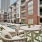 tables and chairs next to jacuzzi and tanning ledge