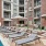 umbrella shaded lounge chairs next to swimming pool